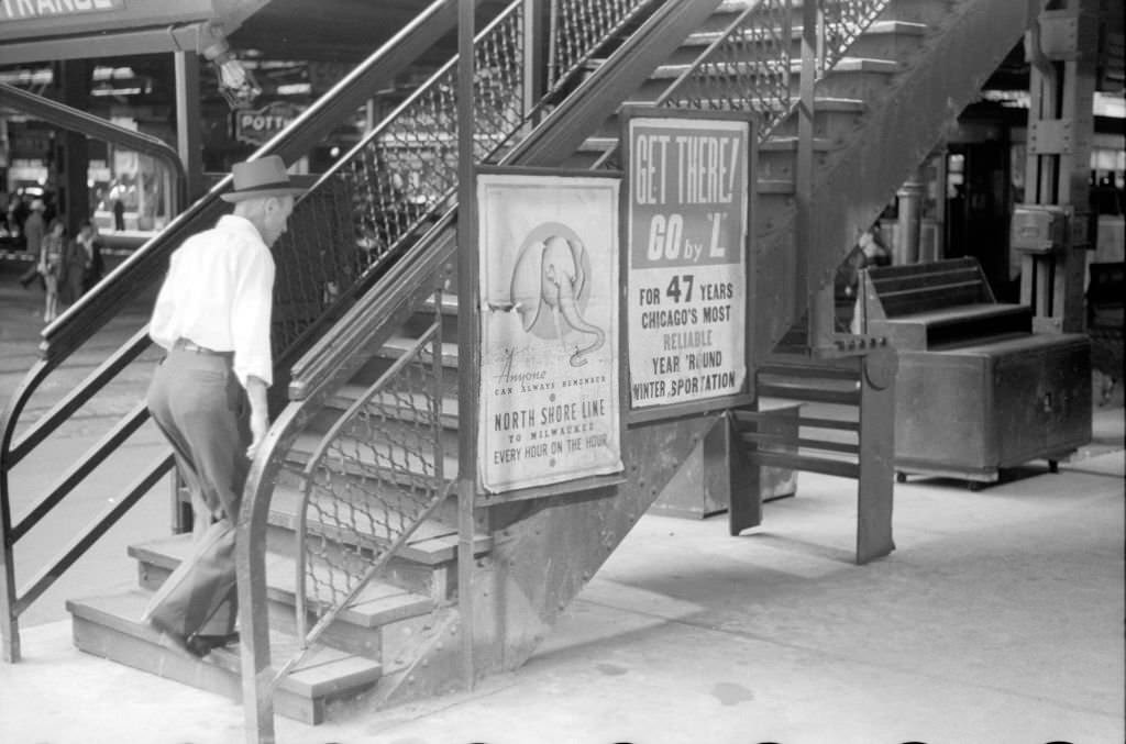 A man as he climbs the steps of the Chicago, July 1941