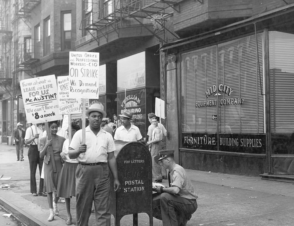 Picket line in front of Mid-City Realty Company. South Chicago, Illinois, 1941.
