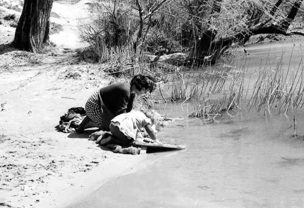 Laundresses in the Jucar river, Cuenca, 1965, Spain.