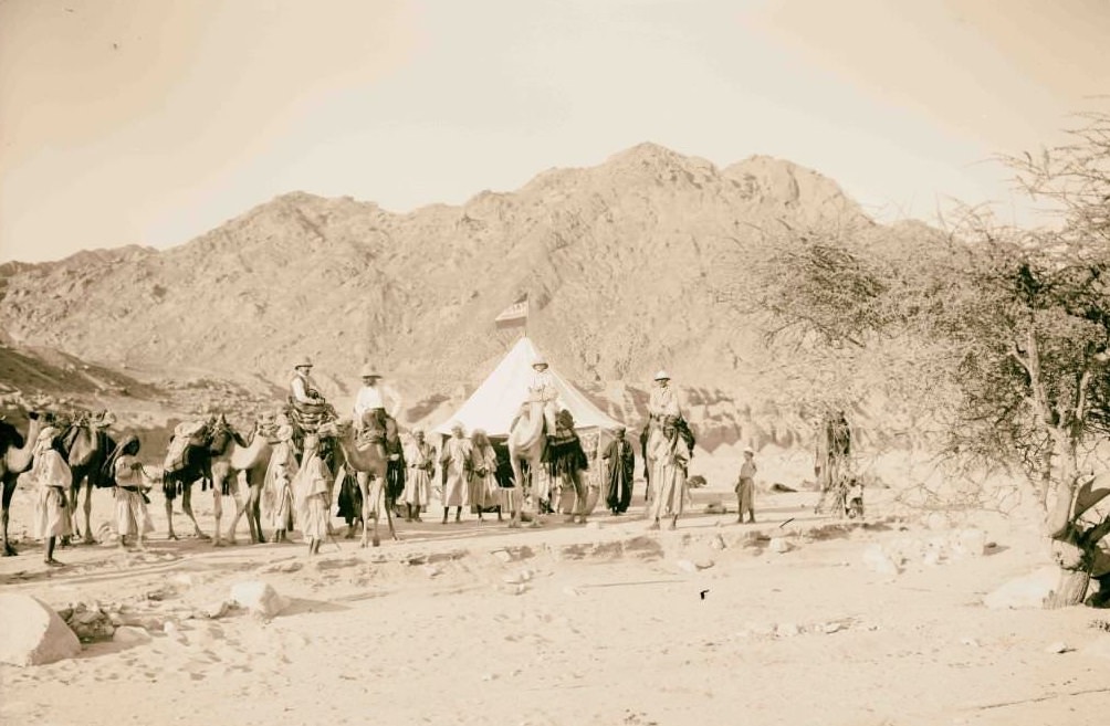 Expedition camp in the Sinai, Lewis Larsson on camel directly in front of tent American Colony, Sinai, 1910