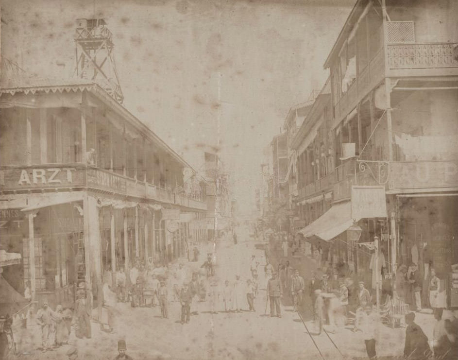 Busy street scene in Port Said with traders and shoppers facing the camera, Egypt, 1910