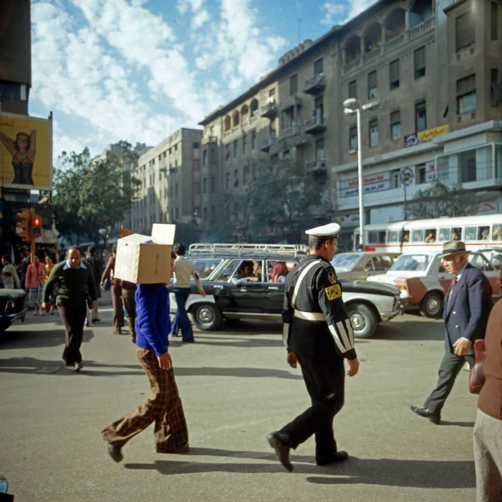 Traffic jam and passers by in the streets of Cairo, Egypt, late 1970s.