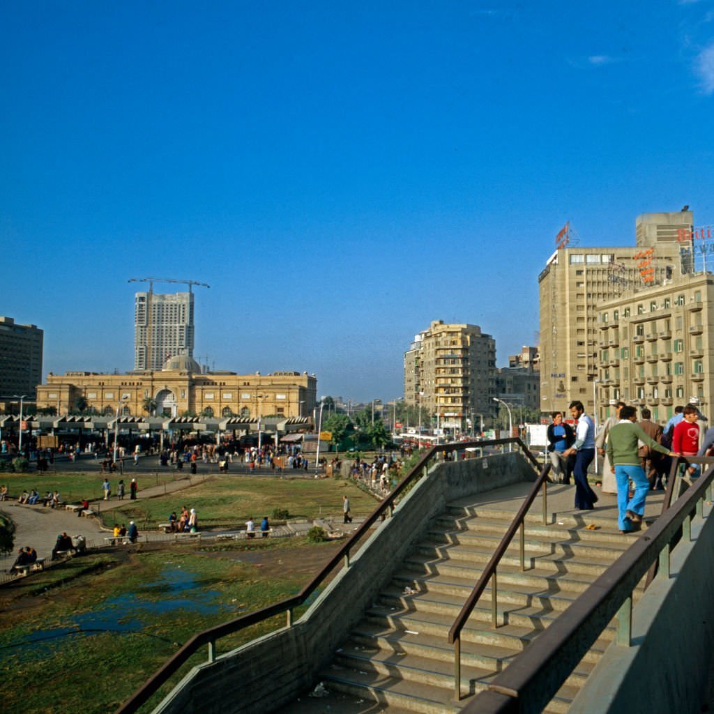 Midan al Tahrir square with the Egyptian Museum and Ramses Hilton Hotel under construction in the background, Cairo, 1970s