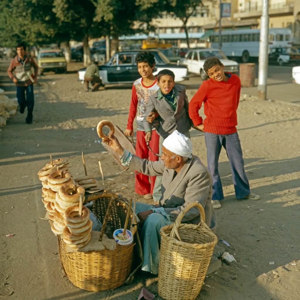 A bread vendor in the streets of Cairo, Egypt, late 1970s.