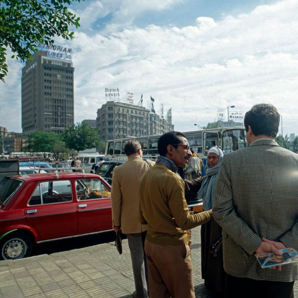 Cairenes discussing on the streets near Midan al Tahrir square at Cairo, Egypt, late 1970s.