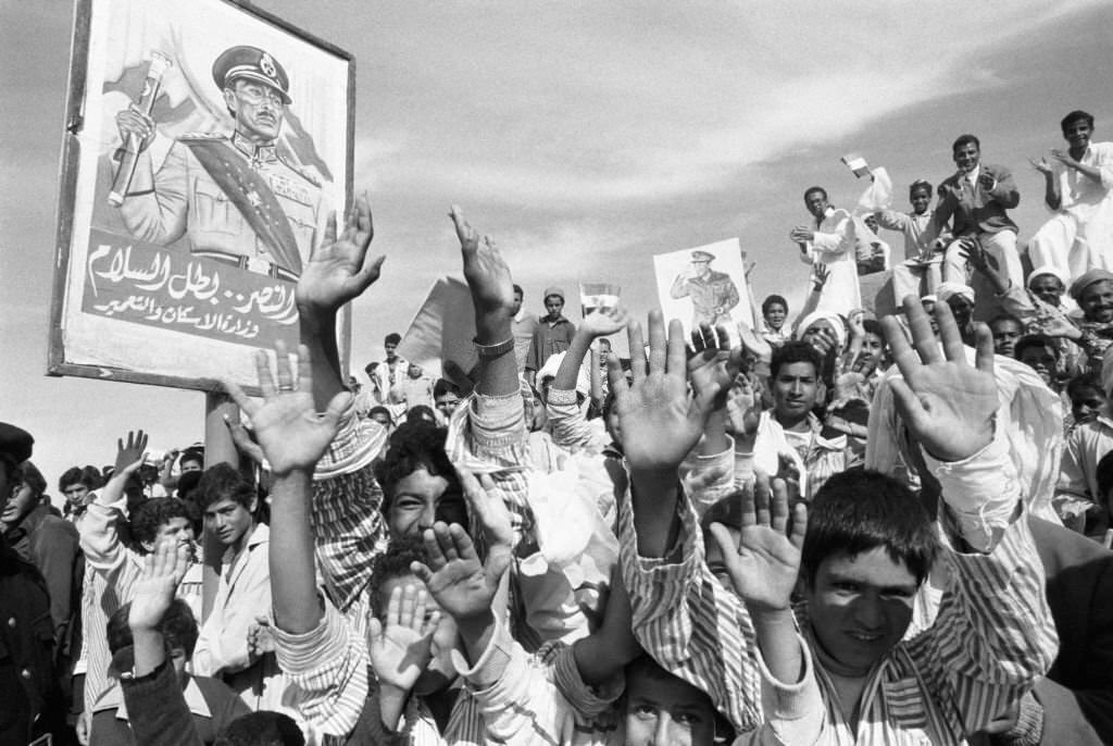 Anouar el-Sadat acclaimed by the Egyptian people during his visit to the village of Serpium, near Ismailia on December 2, 1977, Egypt.