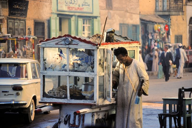Food vendor with shisha pipe and wooden cart, town centre, Luxor, Egypt