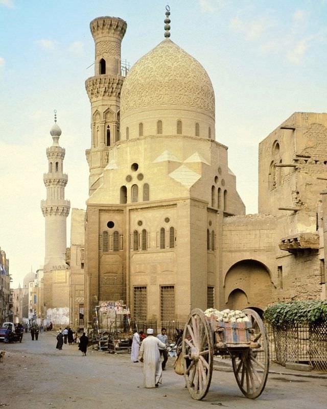 Street scene with mosque and big-wheel donkey cart, Cairo, Egypt