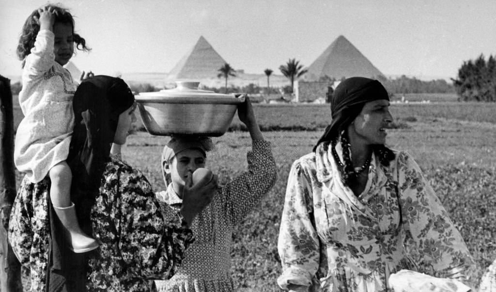 Fellah women in a field in front of the pyramids near Cairo, 1972