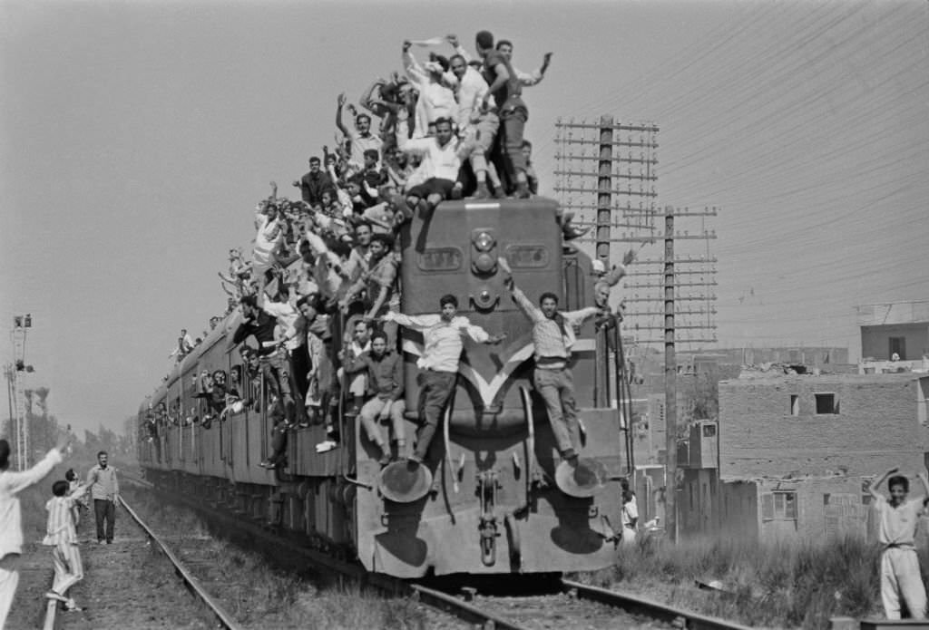 Egyptians overcrowd a train during President Gamal Abdel Nasser's funeral, Cairo, 28th September 1970.
