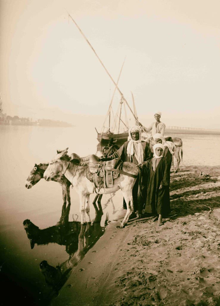 Donkey boys on the banks of the Nile, near Thebes, 1900.