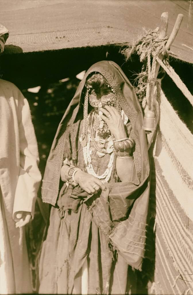 Bedouin woman with all her finery in Sinai, Egypt, 1900.