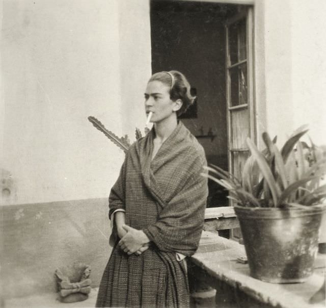 Kahlo smoking at Casa Azul, 1930.
