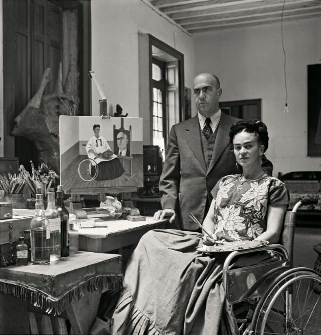 Frida Kahlo at home with Dr. Juan Farill, 1951.