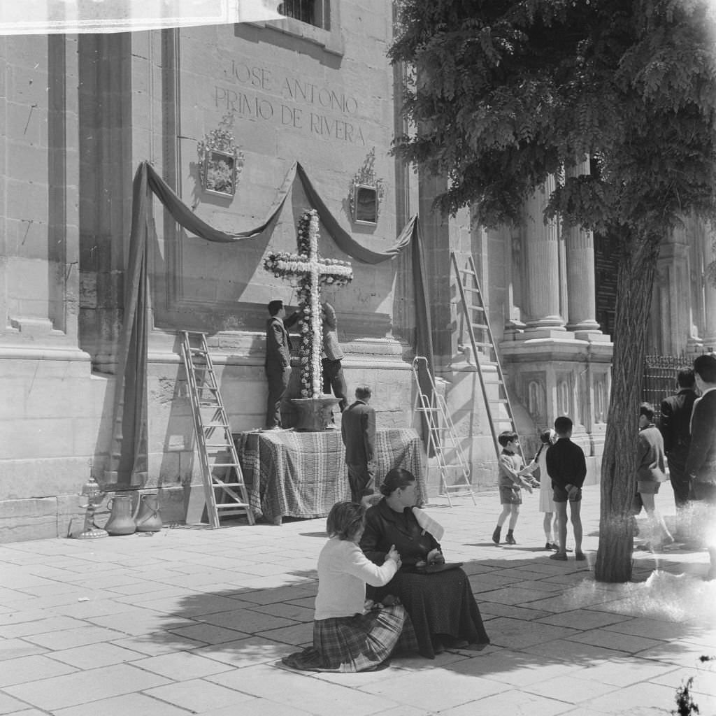 On the occasion of Santa Cruz a floral wreath is hung on a wall of the cathedral, July 27, 1965,