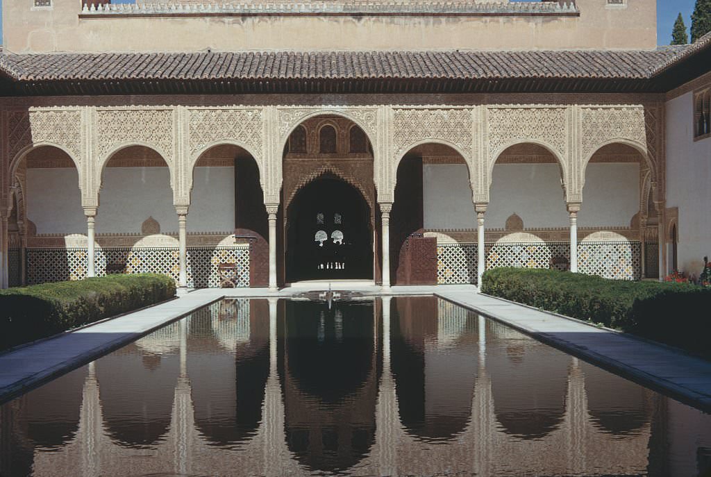 The Court of the Myrtles (Patio de los Arrayanes) of the Alhambra, Granada, Spain, 1960.