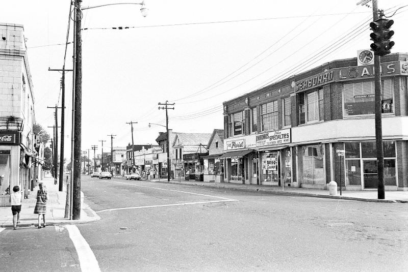 Broadway looking south from Marie St. Henry Huettner's Dept. store, built in 1918, is on the right corner, Hicksville, New York, 1966