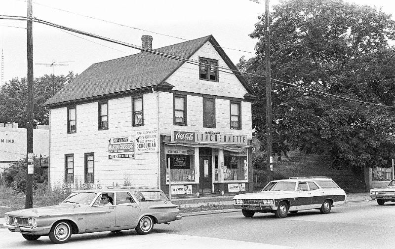 Mary's Luncheonette in center, a private house( recessed to the right ) and the left side of the old Goldman Bros. Store to the right, Hicksville, New York, 1967