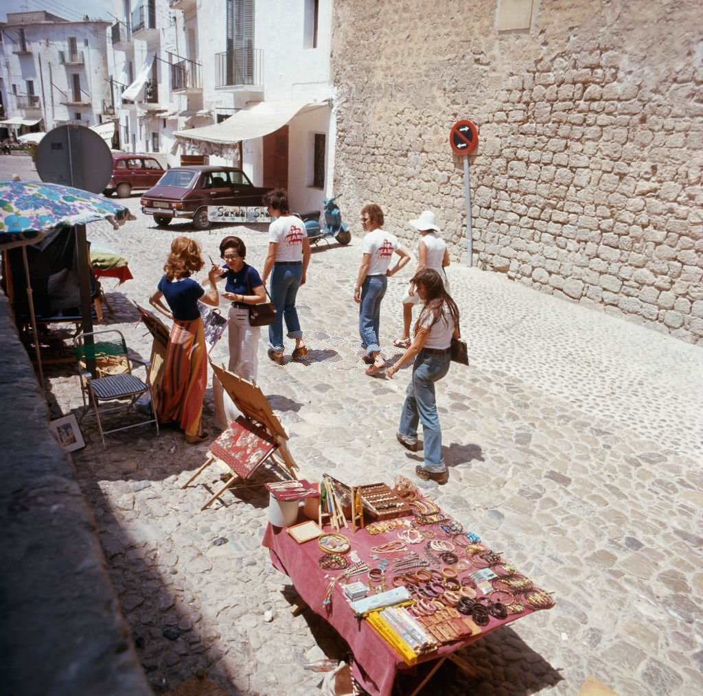 Shopping at a hippie market in the city of Ibiza, Ibiza 1976.