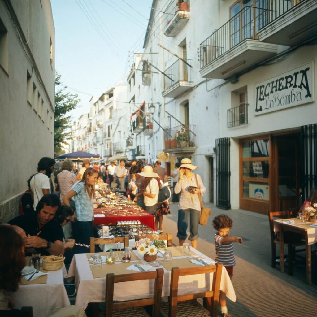 Shopping at a hippie market in the city of Ibiza, Ibiza 1976.