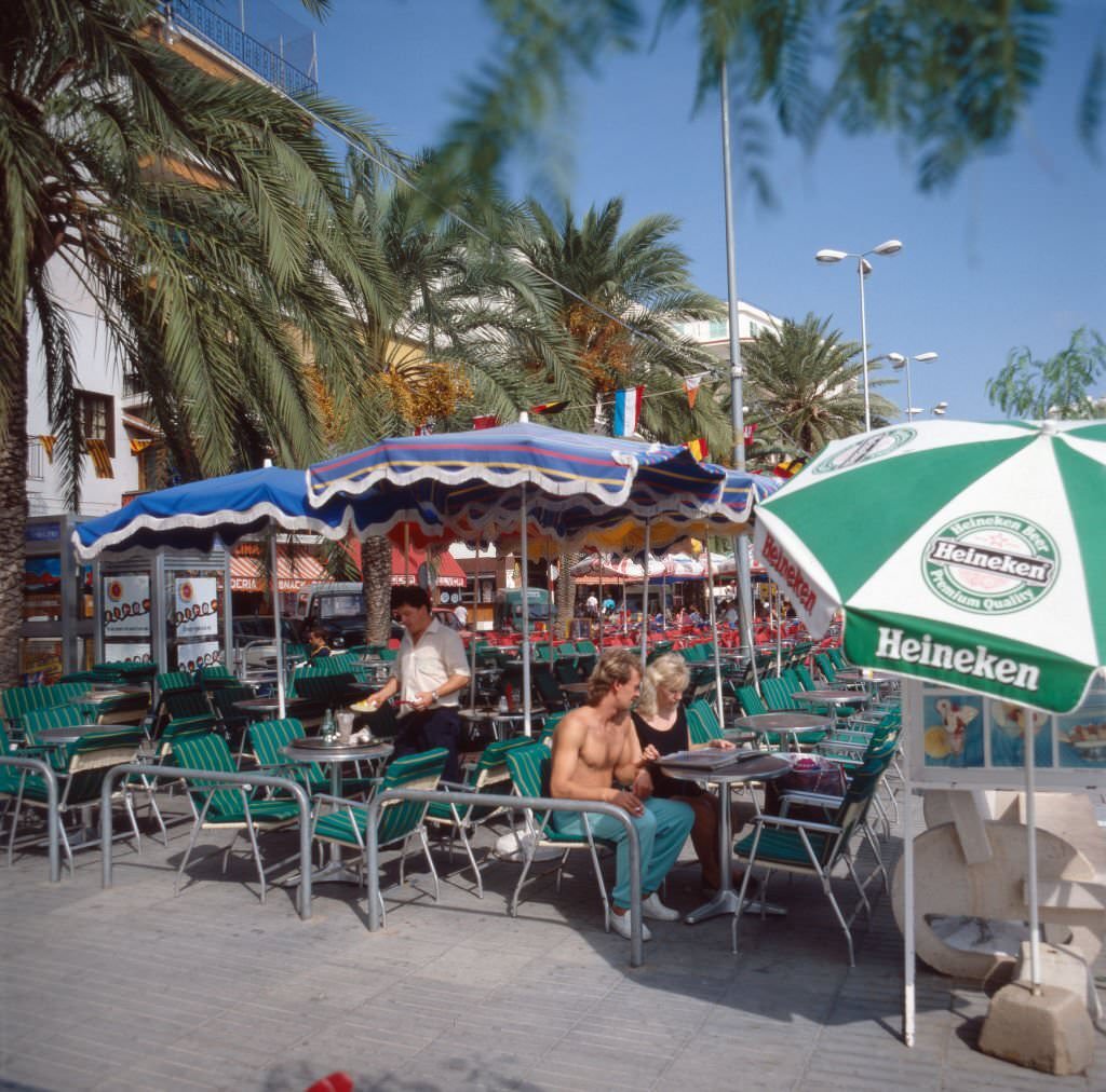 A couple relaxing in a cafe of Sant Antoni de Portmany on the island of Ibiza, 1976