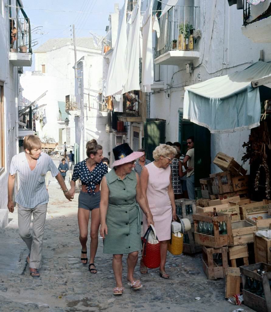 Tourists through the streets of Ibiza, Balearic Islands, Spain, 1975