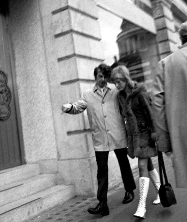 Fashionable couple walking near St Paul’s, London, March 1973