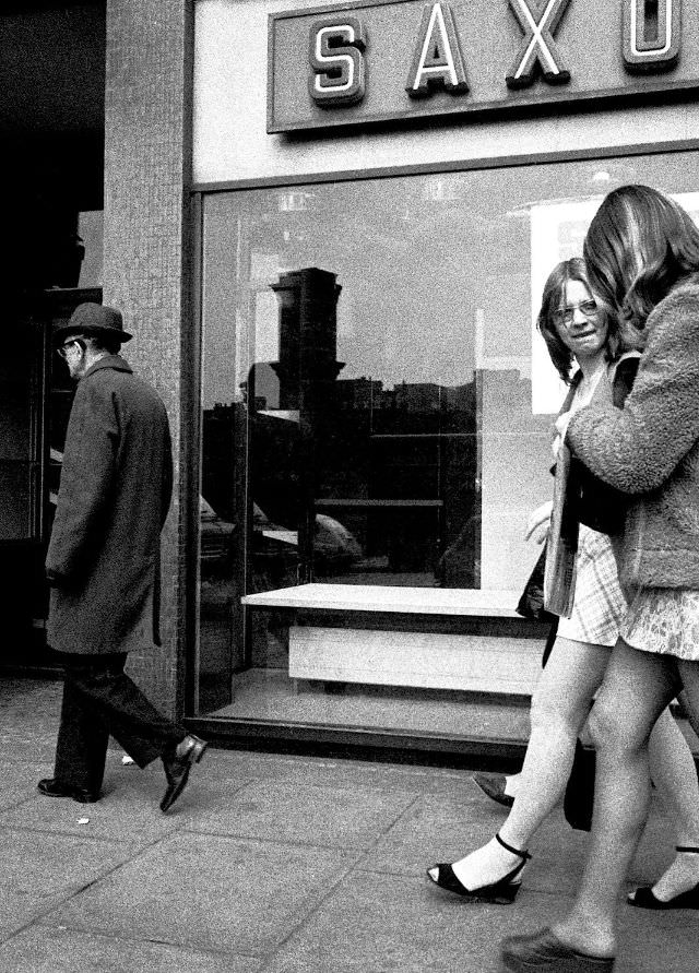 Lunchtime stroll to check the shops and catch up on the scandal, London, April 1973