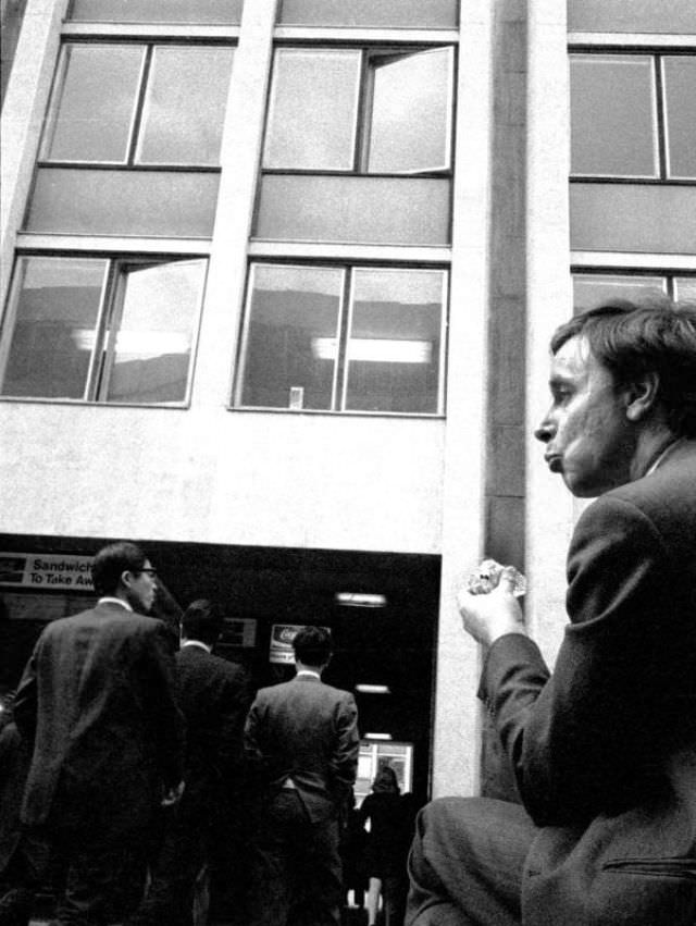 Office worker enjoying a lunchtime sandwich near St Paul's, London, April 1973