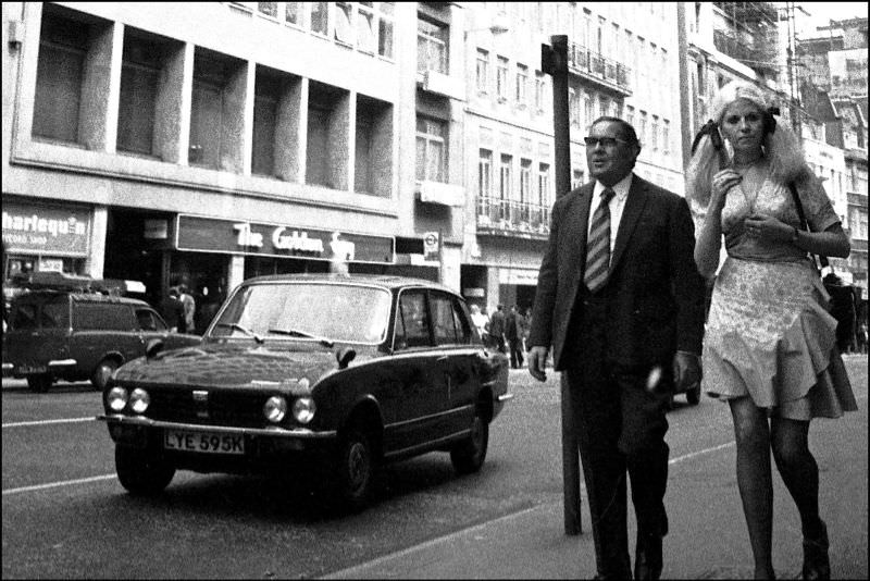 Smart couple on High Holborn, London, June 1973