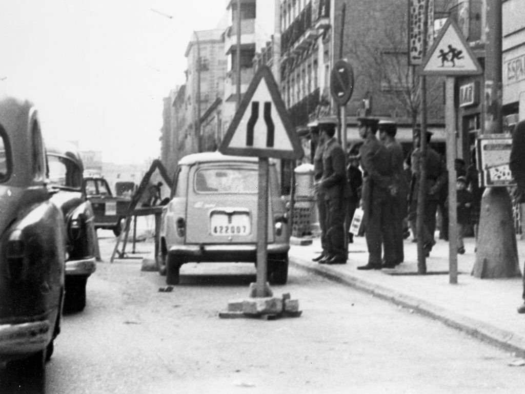 On a street in the Spanish capital on the eve of May Day, a group of Civil Guards, in Madrid, 1968