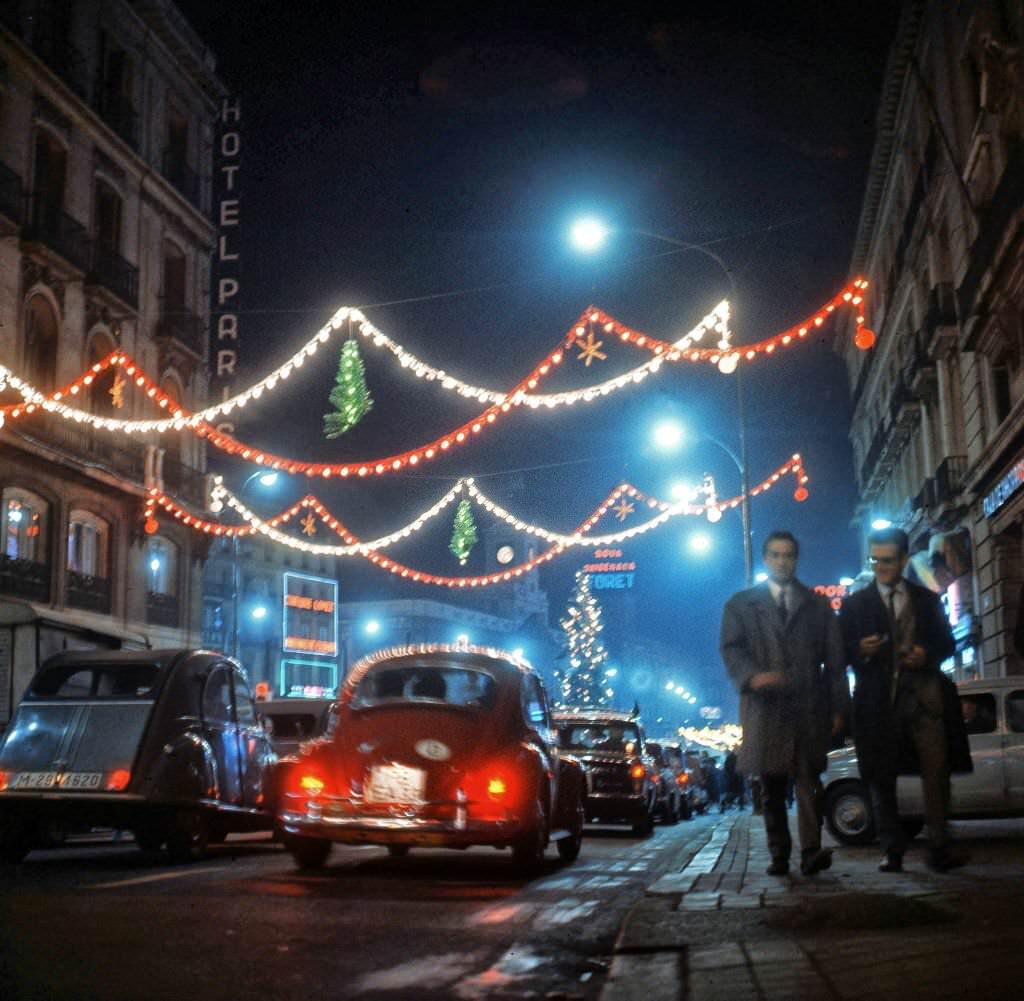 A Madrid street decorated with Christmas lights, in Madrid, Spain, late 1960s.