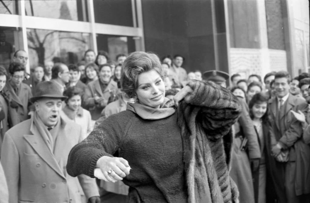 Italian actress Sophia Loren leaves a building in Madrid during her visit to film the blockbuster El Cid on January 30, 1961 in Madrid, Spain.