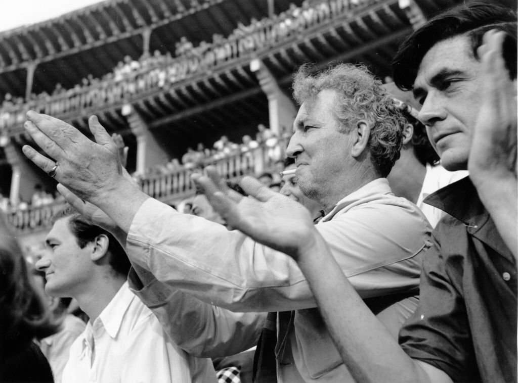 Robert von Ranke Graves applauds a bullfighter at the ring in Palma de Majorca.