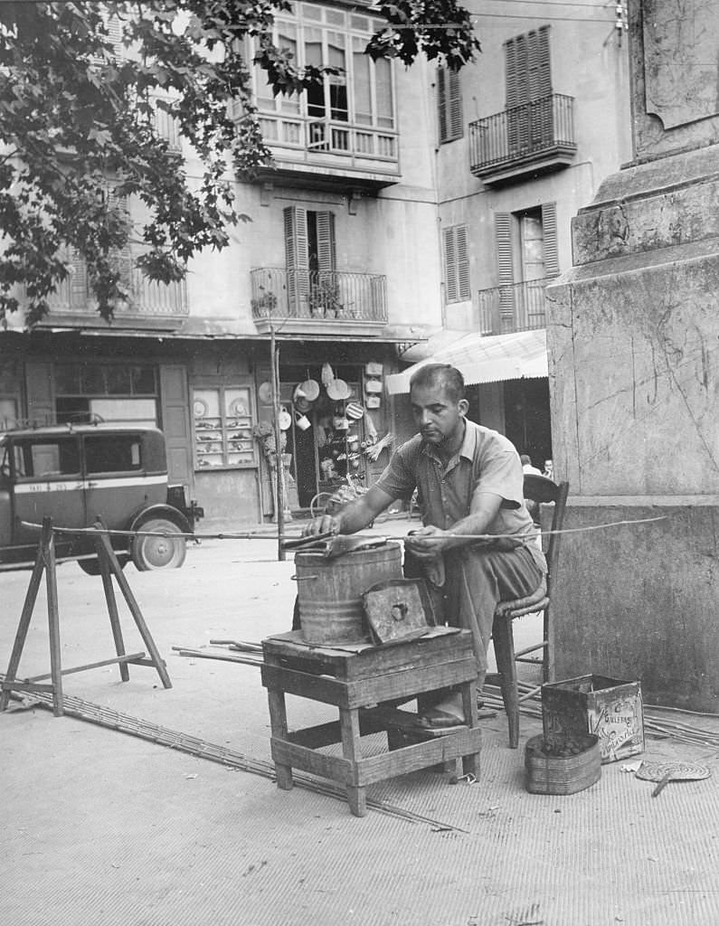 Palma de Mallorca, a craftsman works on the street, Mallorca, 1950