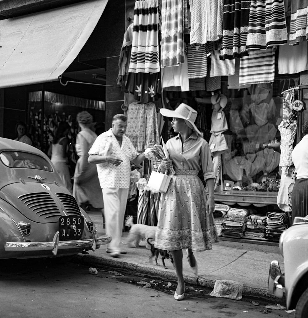 Actress and singer Abbe Lane walks through the streets of Mallorca, 1959