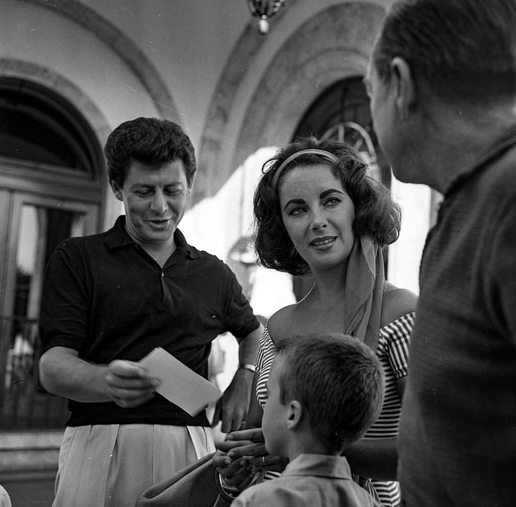 British actress, Elizabeth Taylor and her current husband, Eddie Fisher (L) enjoy a holiday in Mallorca, 1959
