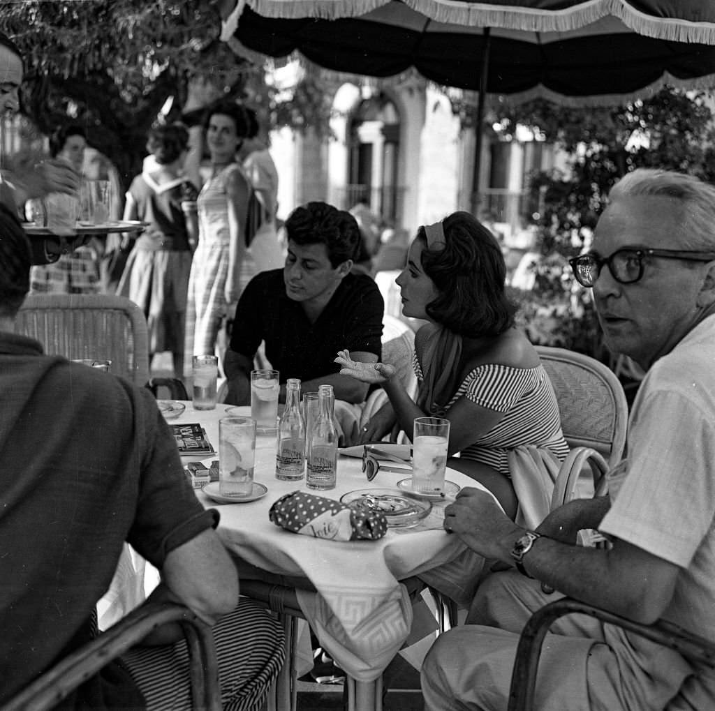 British actress, Elizabeth Taylor and her current husband, Eddie Fisher (L) enjoy a holiday in Mallorca, 1959