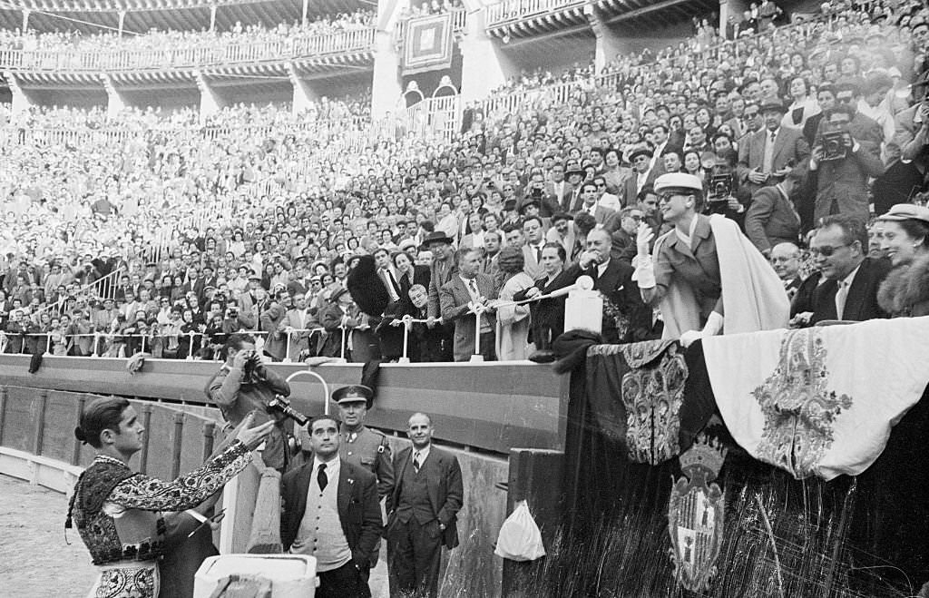 Princess Grace Tossing a Cap to a Matador.