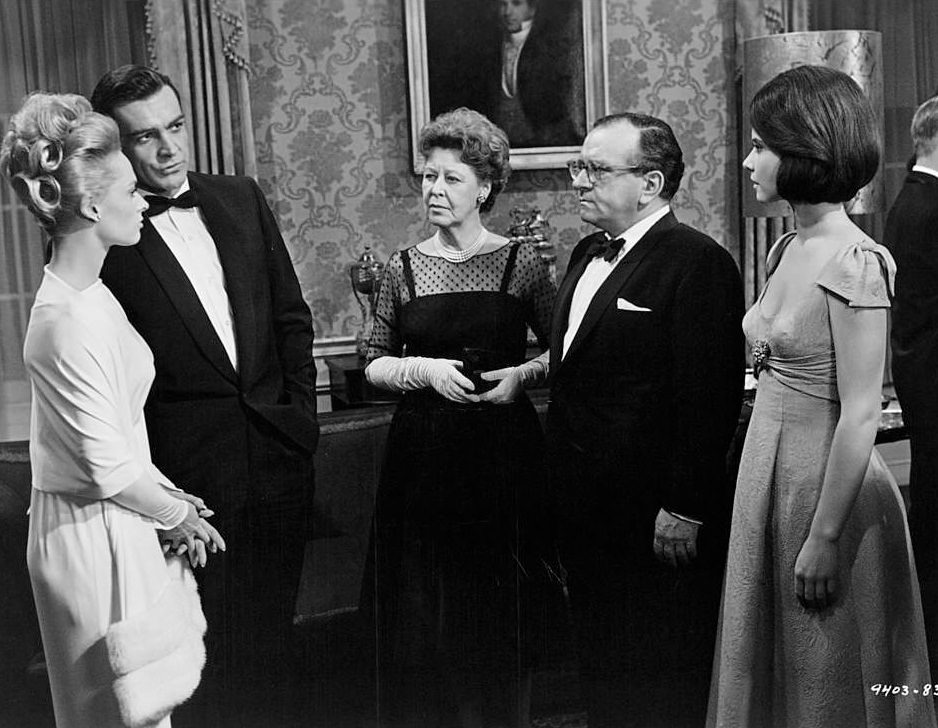 Tippi Hedren and Sean Connery put up a bold face when confronted by their former employer Martin Gabel with Louise Lorimer and Diane Baker as spectators in 'Marnie', 1964.