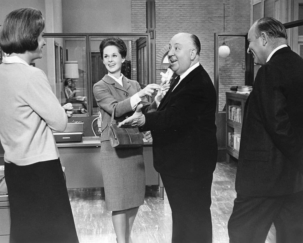 Tippi Hedren with Alfred Hitchcock on the set of his movie Marnie, 1964