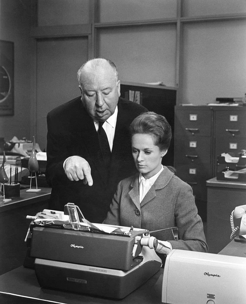 Tippi Hedren with Alfred Hitchcock on the set of his movie Marnie, 1964