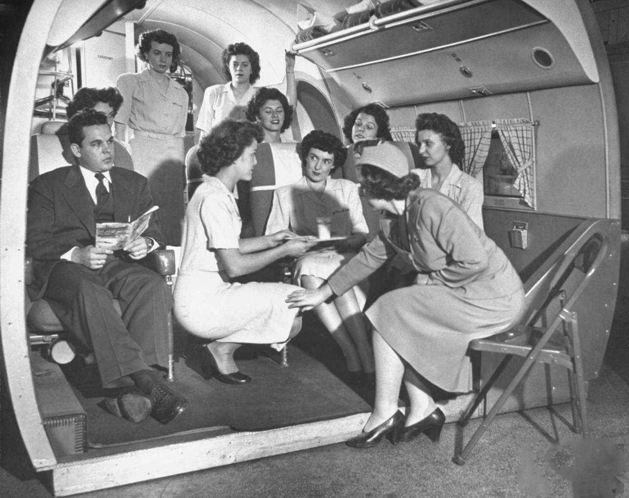 Students at the McConnell Air Hostess School learning the right and wrong ways to serve passengers.
