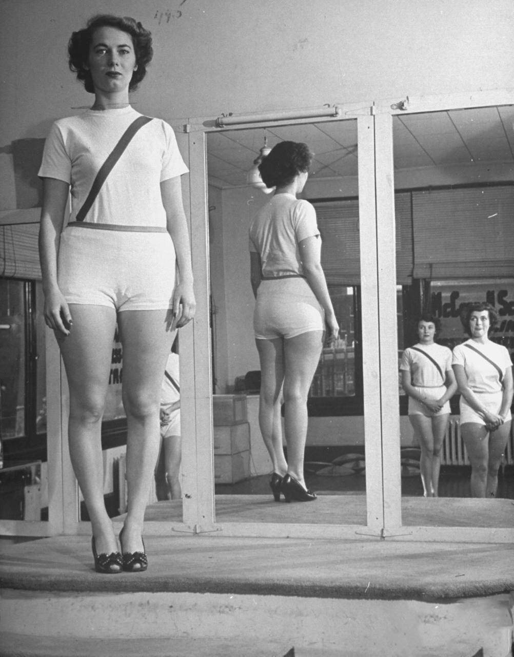 Women checking their posture at the McConnell Air Hostess School.