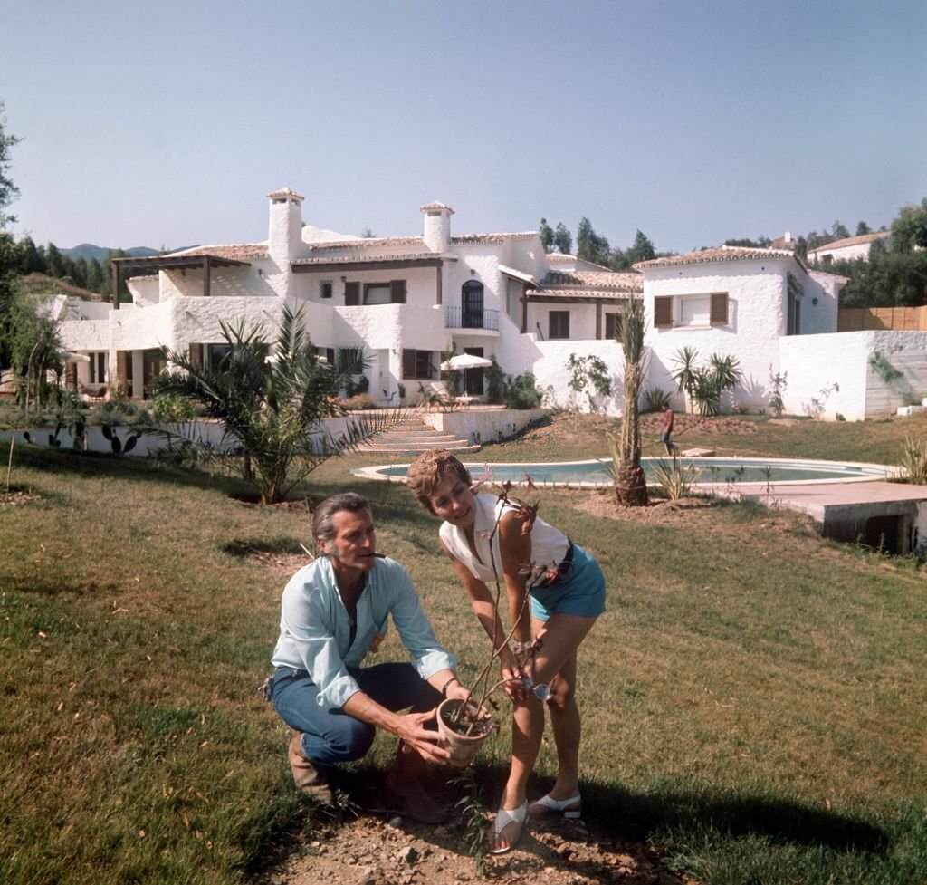 German actress Lilli Palmer and her husband Carlos Thompson plant a bush in the garden of their property in Campo Mijas on the Costa del Sol in Spain, 1970