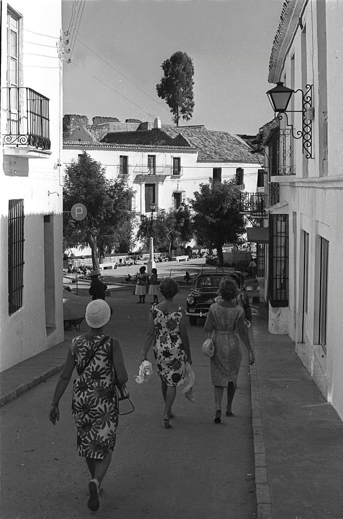Tourists walking on a tipical street in Mijas