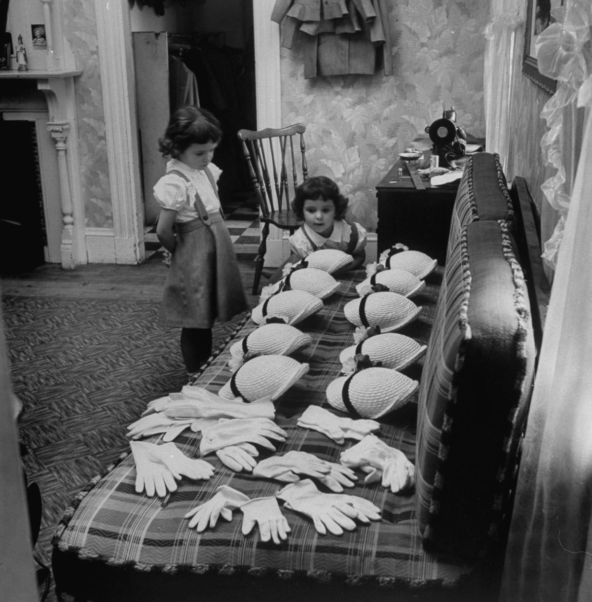 The O’Neil girls’ hats and gloves were inspected by the youngest sisters in preparation for Easter, 1952.