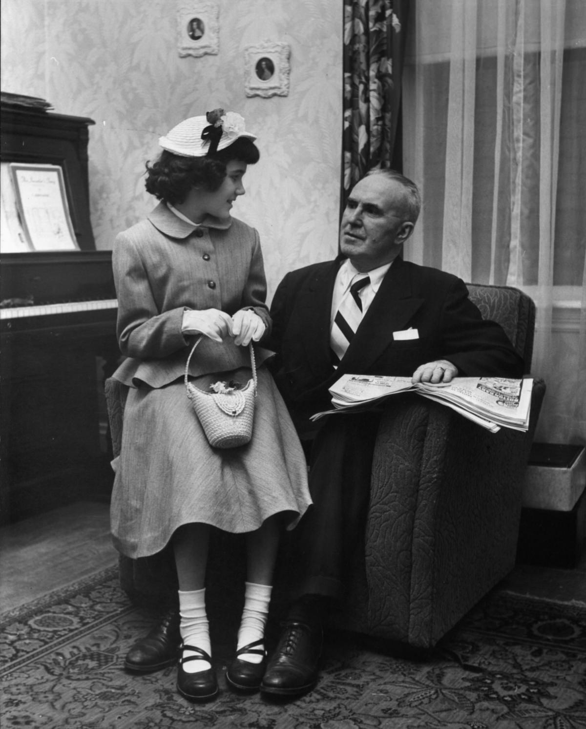 Daniel O’Neil with one of his ten daughters in a new Easter outfit, April 1952.