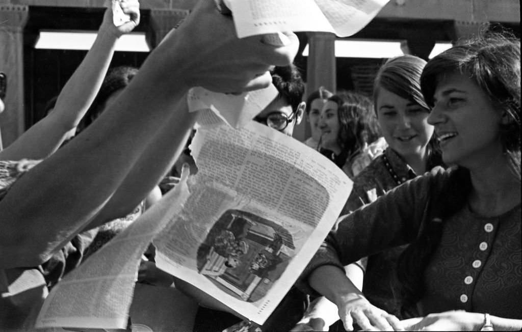 On the Atlantic City Boardwalk, demonstrators, among them Helen Kritzler (right), tear up magazines as they protest the Miss America beauty pageant, Atlantic City, New Jersey, September 7, 1968.