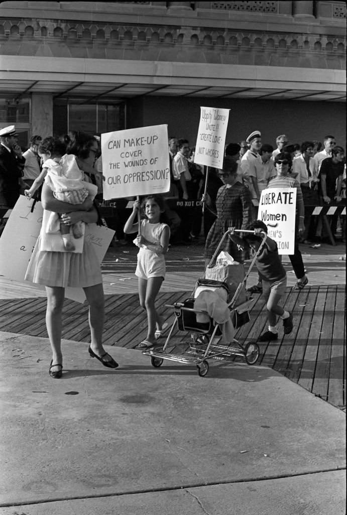 Demonstrators carry posters as they protest the Miss America beauty pageant, Atlantic City, New Jersey, September 7, 1968.